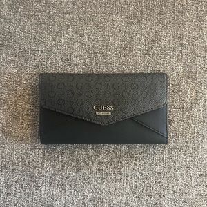 black guess wallet with silver detail